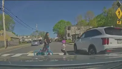 Girl, father nearly hit in crosswalk by SUV in Attleboro
