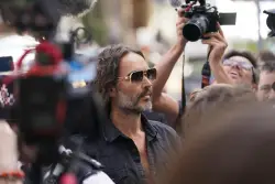Russell Brand granted conditional bail after appearing in London court on rape and assault charges