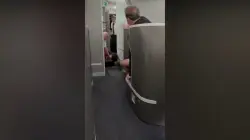 American Airlines passenger restrained, knocked to floor while barging into cockpit: video